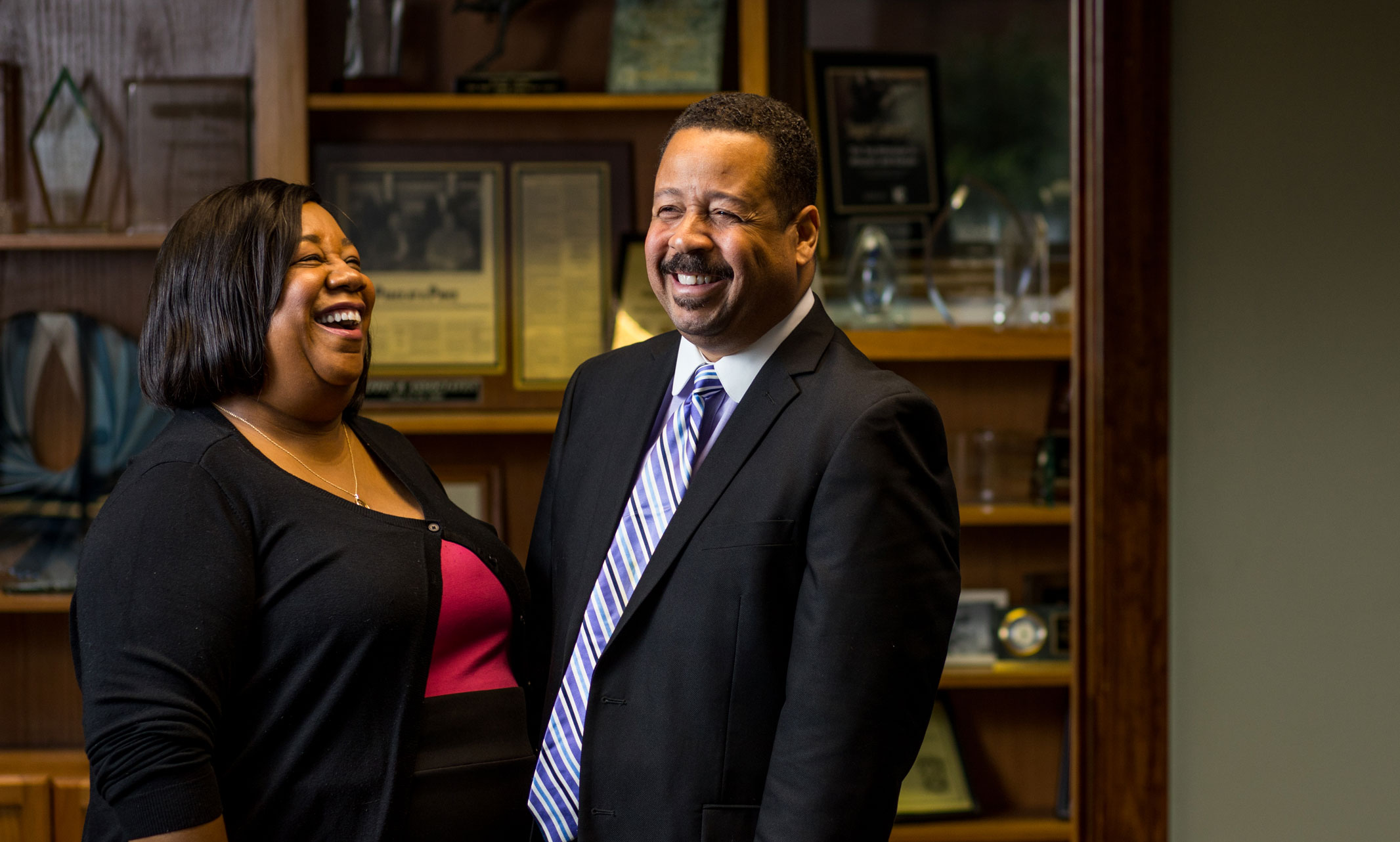 Dana and Keith Cutler laugh together in their Kansas City law office. Photo by Brandon Parigo, Strategic Marketing and Communications.