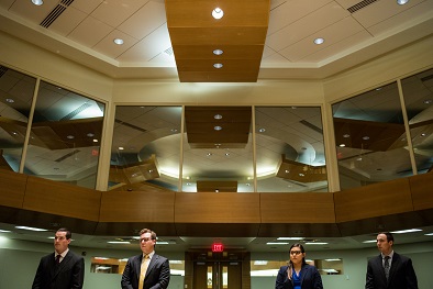 Law students participate in a mock trial in a law school classroom